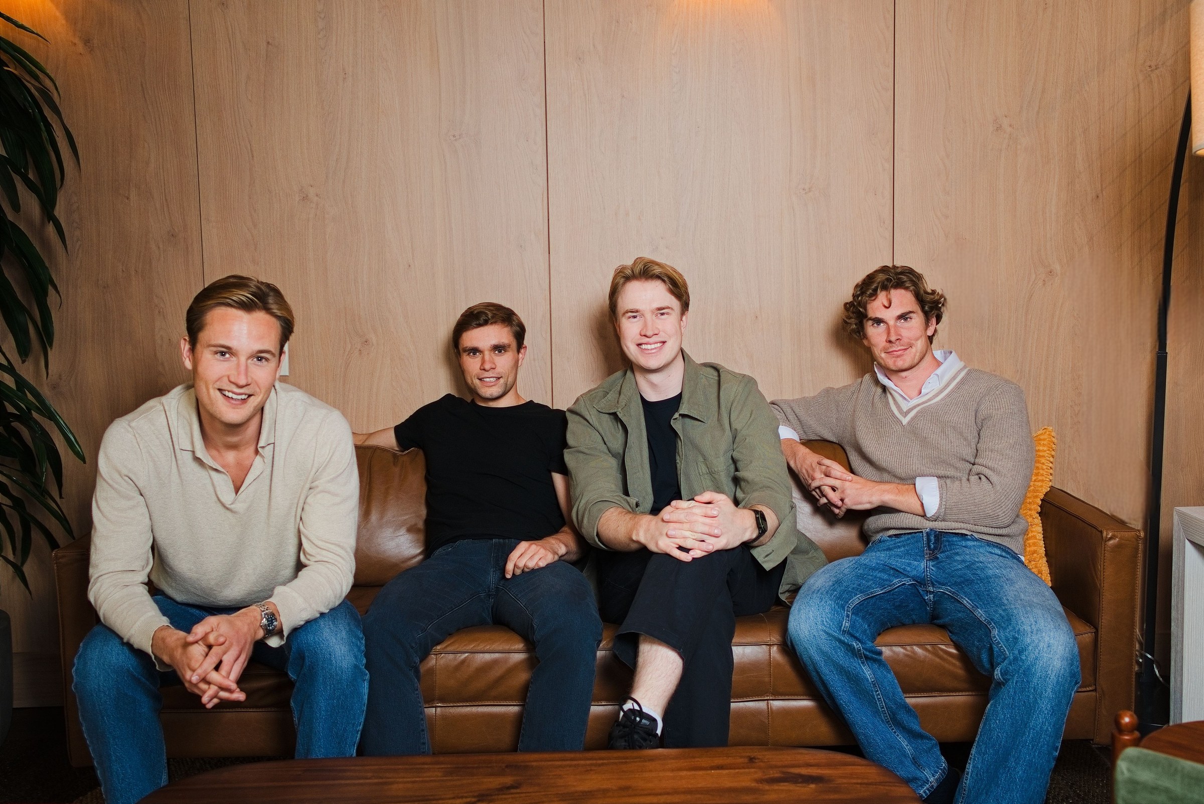 Four members of the Audun team sitting together on a sofa.